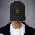 Front of black RRT Open Range trucker hat with warm neutral embroidery